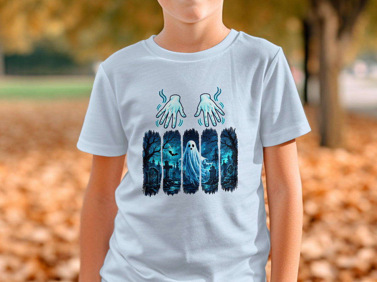 T-shirt with Halloween ghost, gravestones, trees, and two glowing hands.