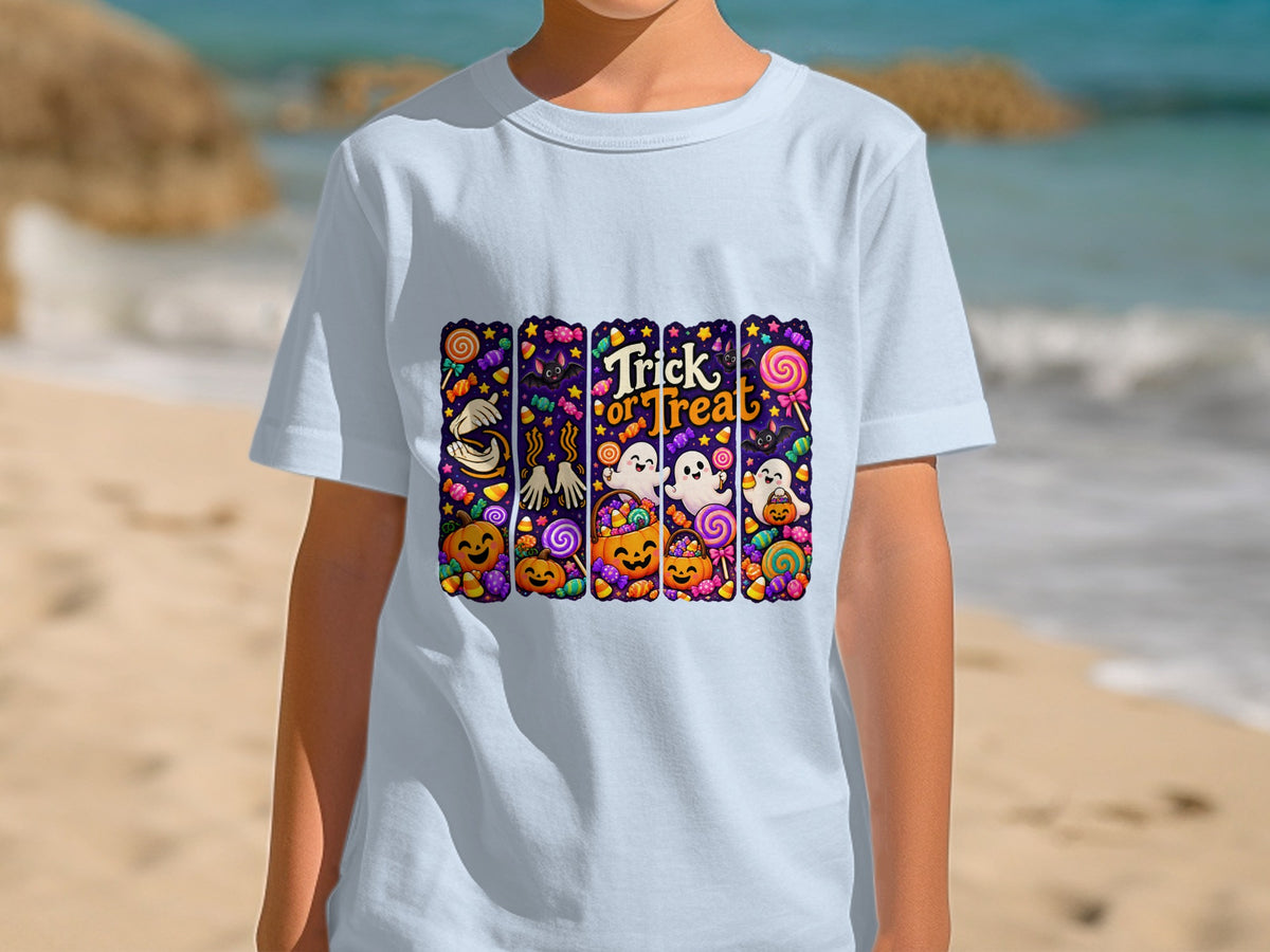 Light blue t-shirt with colorful Halloween graphic featuring "Trick or Treat" text, pumpkins, ghosts, and candy.
