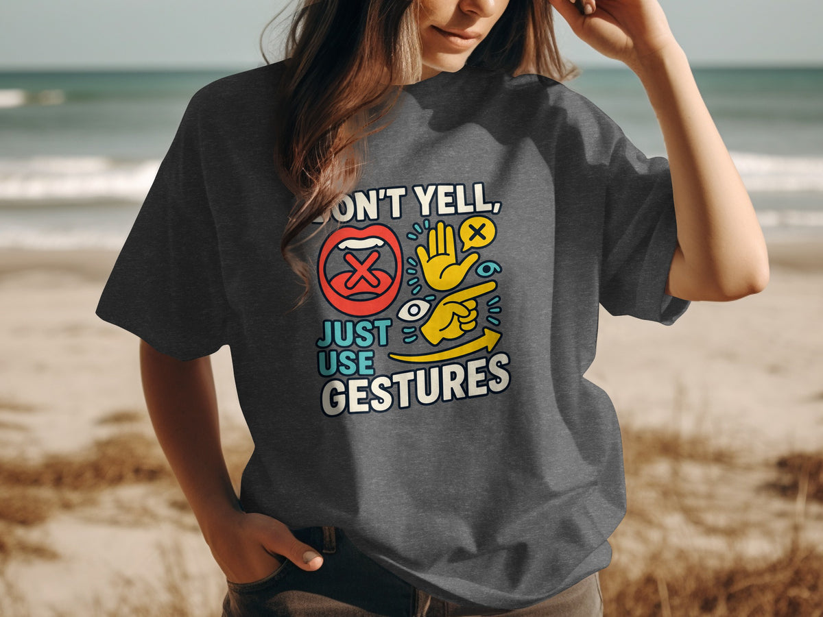 T-shirt with text "DON'T YELL, JUST USE GESTURES" and graphic icons.