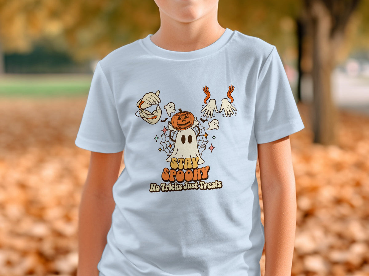 Light blue t-shirt with Halloween graphic featuring ghost, pumpkin, hands, and text "STAY SPOOKY No Tricks Just Treats".