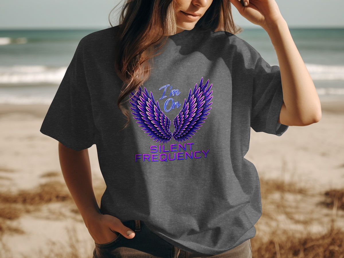 Dark grey t-shirt with purple wings and text "I'm On Silent Frequency".