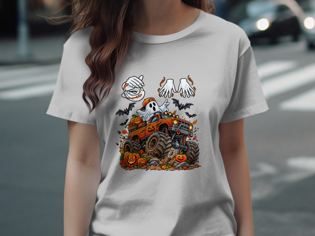 Halloween t-shirt design with a ghost driving a monster truck, pumpkins, and bats.
