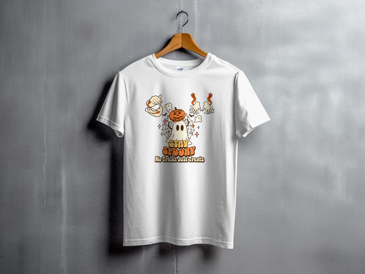 White t-shirt with Halloween graphic of a ghost, pumpkin, and text.