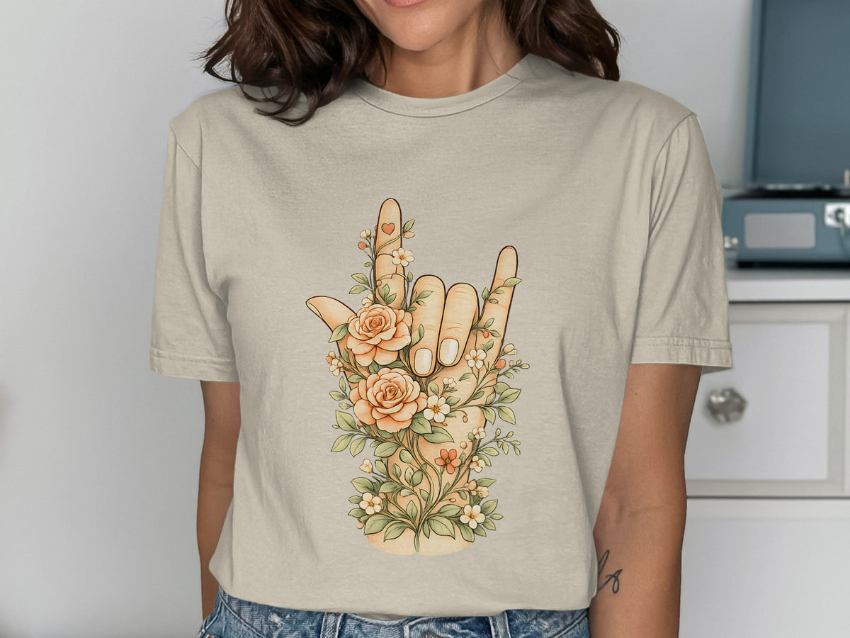 Tan t-shirt with a floral I Love You hand gesture design.