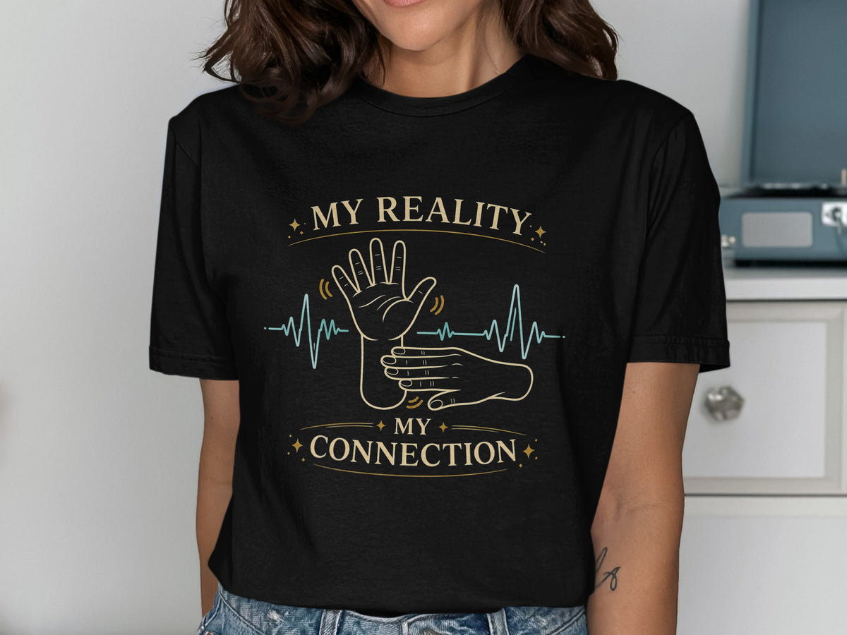 Black t-shirt with text "MY REALITY MY CONNECTION" and a heartbeat graphic.