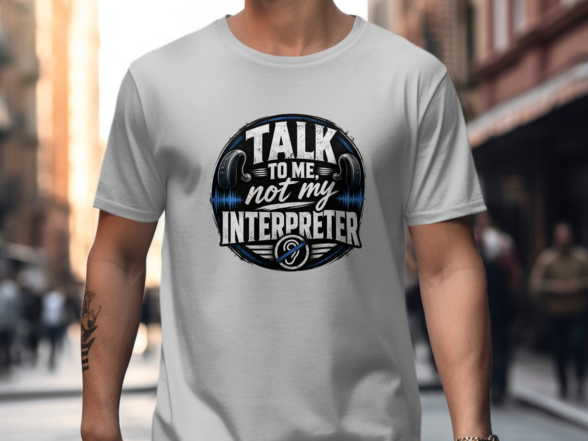 Gray t-shirt with "Talk to me, not my interpreter" graphic and headphones.