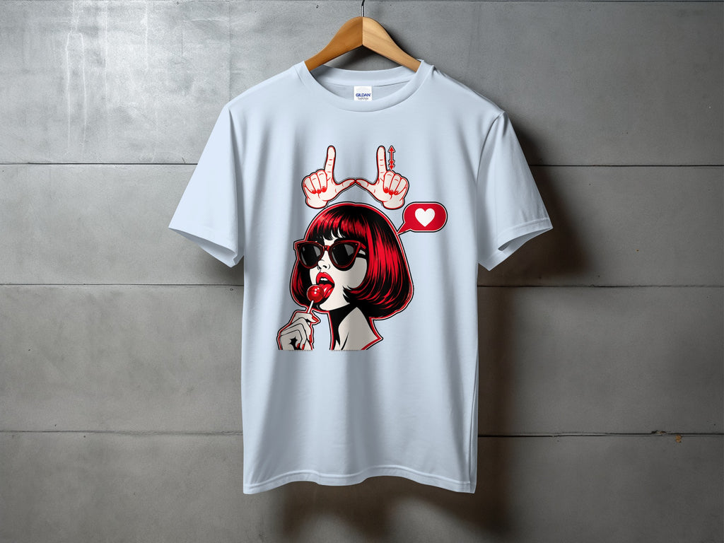 Light blue t-shirt with graphic of woman licking lollipop, heart speech bubble, and hand gesture.