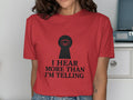 Red t-shirt with a black keyhole graphic containing an eye and text "I HEAR MORE THAN I'M TELLING".