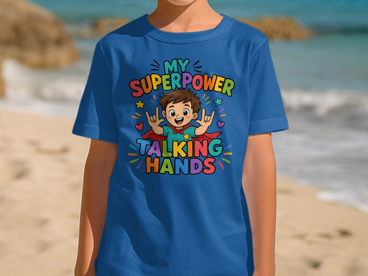 Blue t-shirt with text "MY SUPERPOWER TALKING HANDS" and a cartoon boy.