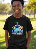 Black t-shirt with blue text "I LISTEN WITH MY EYES" and eye graphic.
