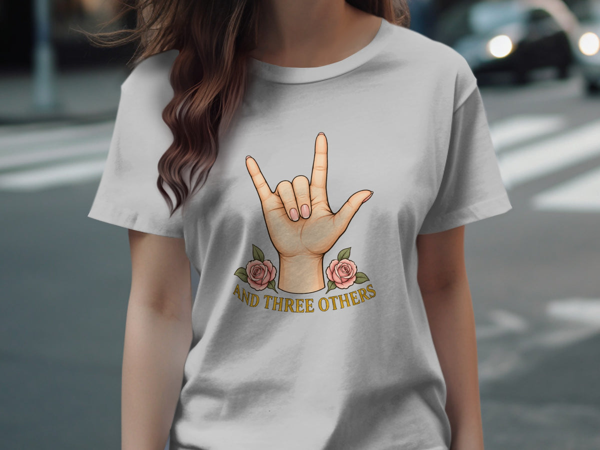 T-shirt with hand sign for "I love you" and text "AND THREE OTHERS".