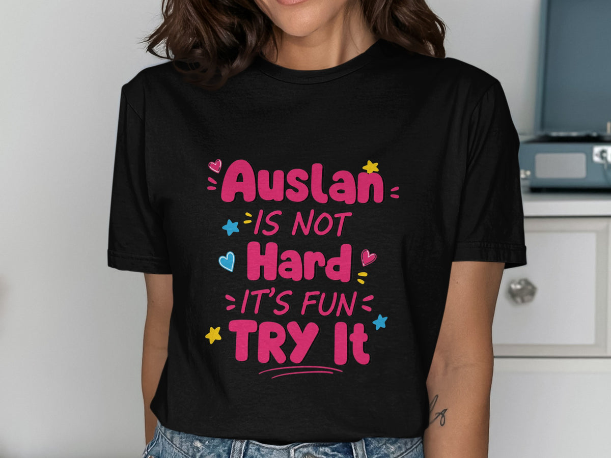 Black t-shirt with text "Auslan IS NOT Hard: IT'S FUN: TRY IT" and colorful accents.