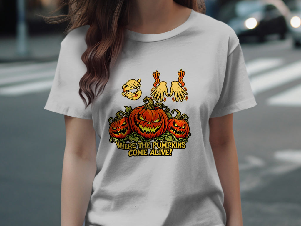 T-shirt graphic with three jack-o'-lanterns and text "Where the pumpkins come alive!"