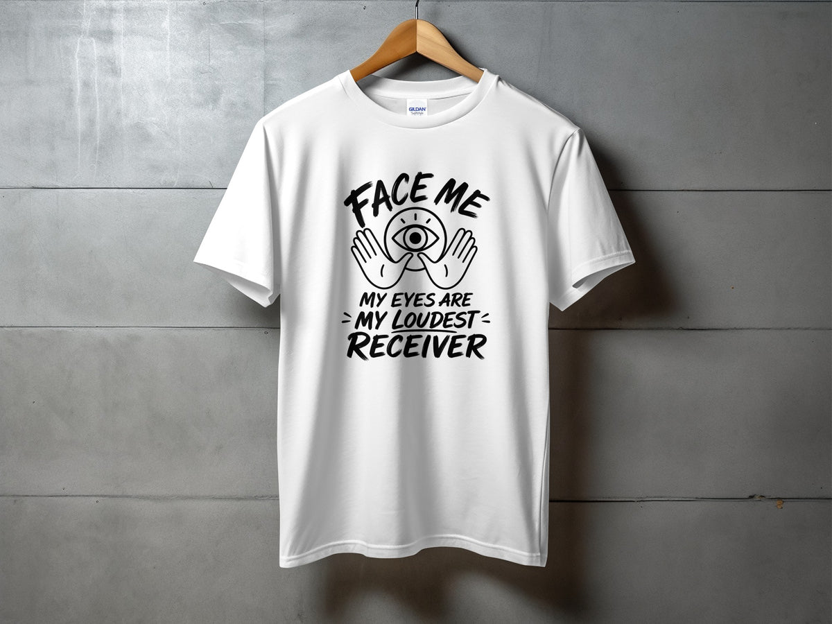 White t-shirt with "Face Me, My Eyes Are My Loudest Receiver" text and eye graphic.