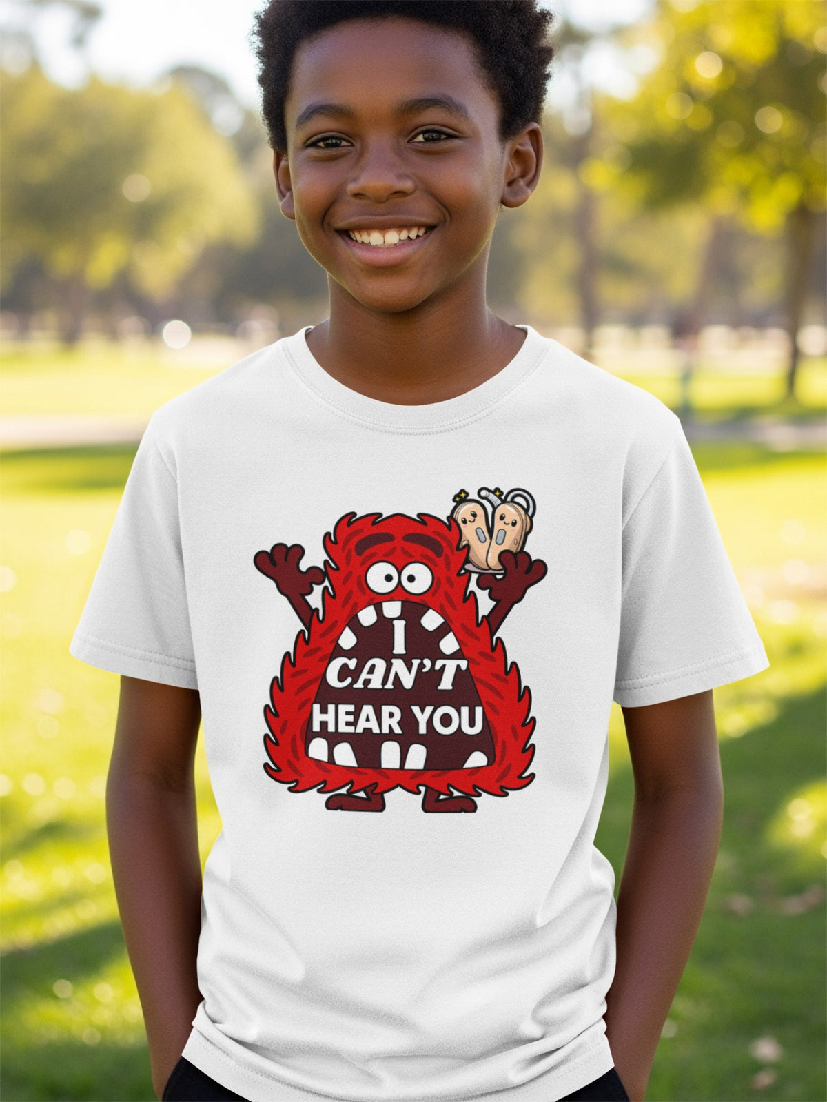 White t-shirt with red monster graphic that says "I CAN'T HEAR YOU".