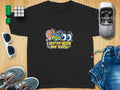 Black t-shirt with colorful graphic and text "I LISTEN WITH MY EYES."