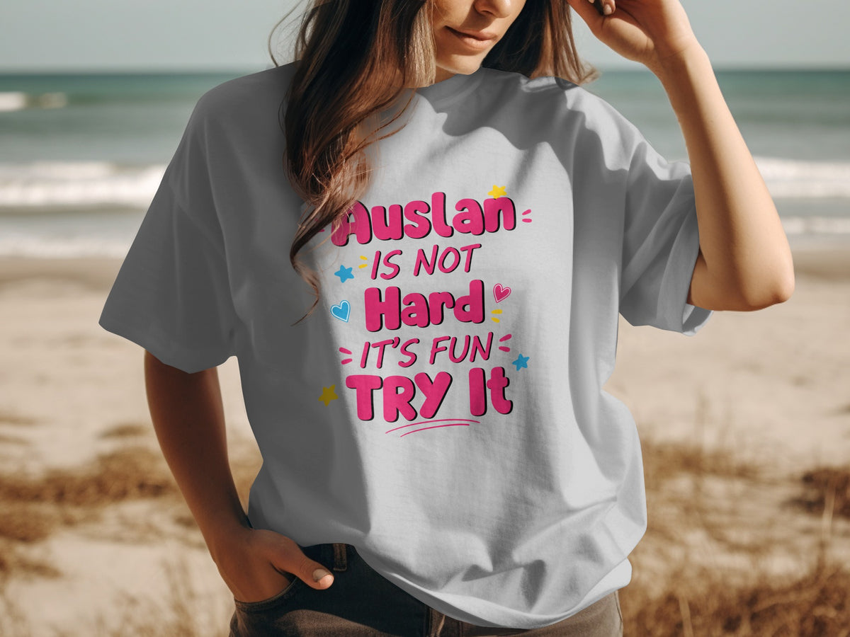 Gray t-shirt with "Auslan is not hard, it's fun. Try it." text and colorful accents.