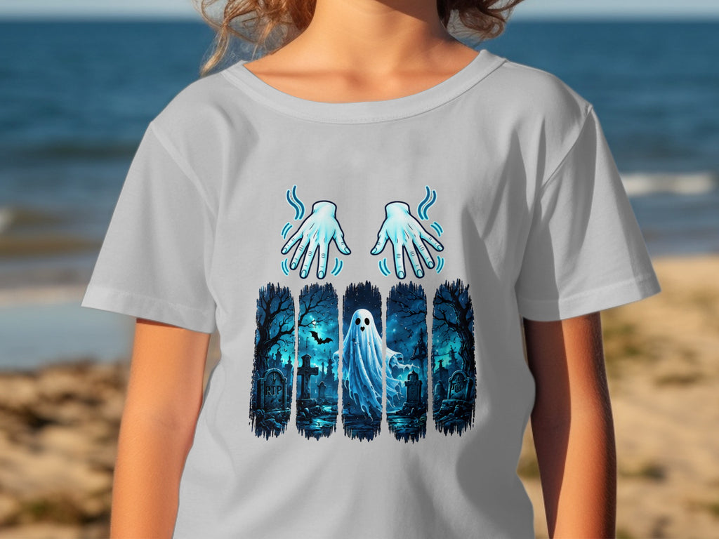 Ghost in a graveyard with glowing hands graphic on a t-shirt.