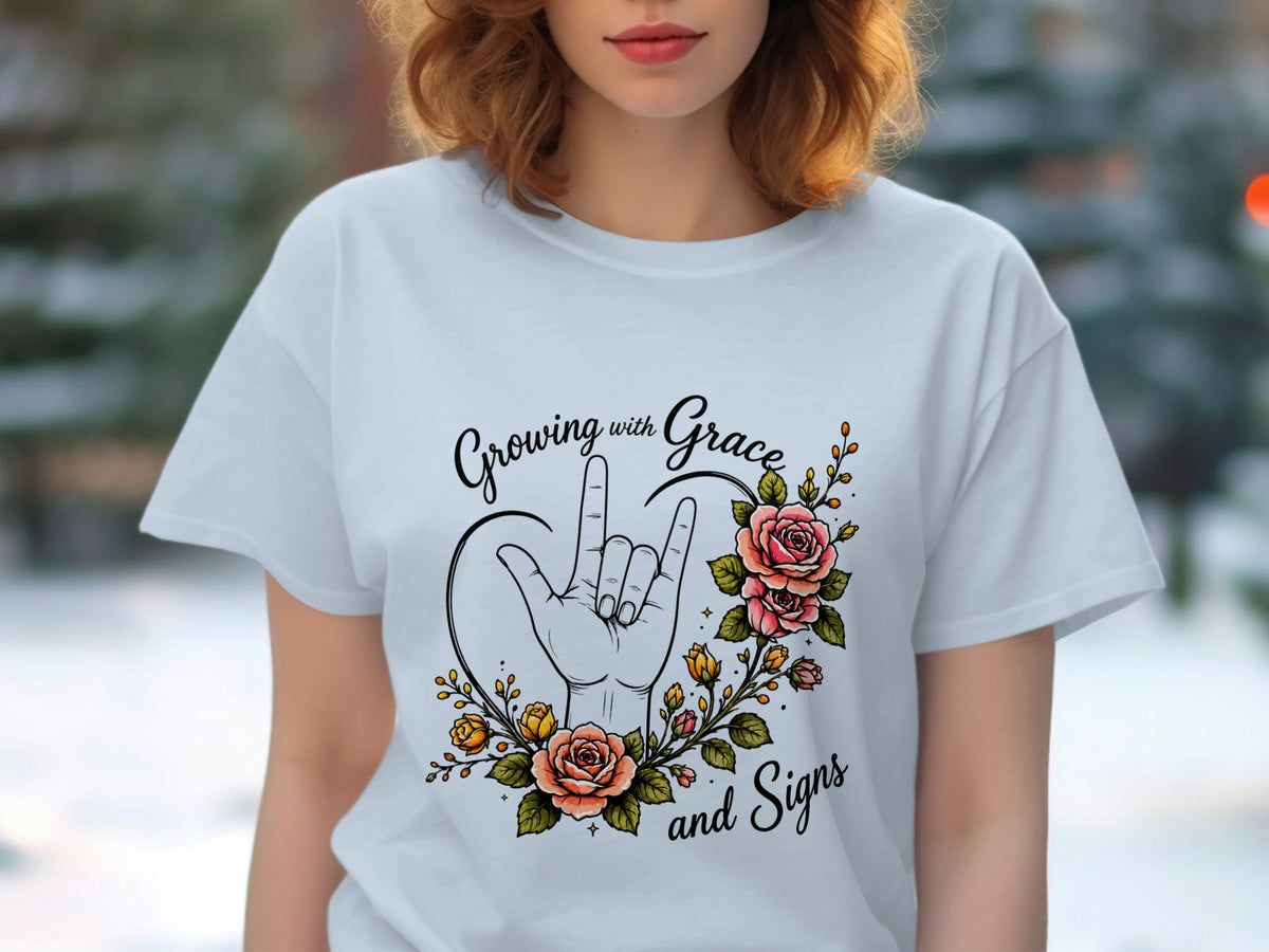 White t-shirt with "Growing with Grace and Signs" text and floral hand sign.