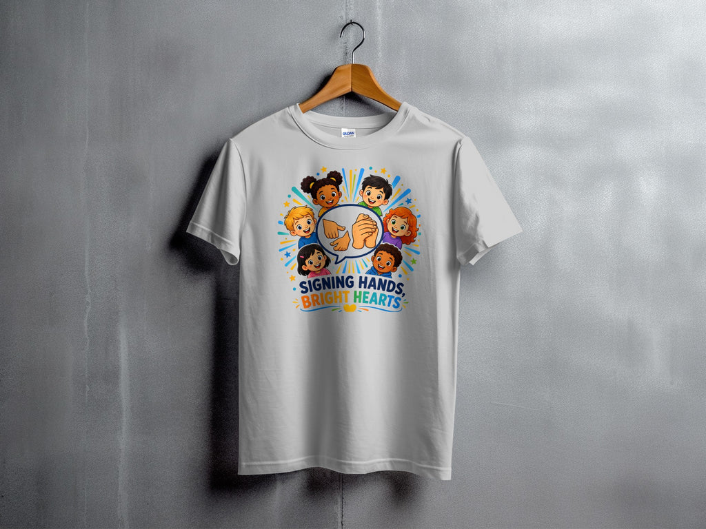 White t-shirt with cartoon children and text "Signing Hands, Bright Hearts".