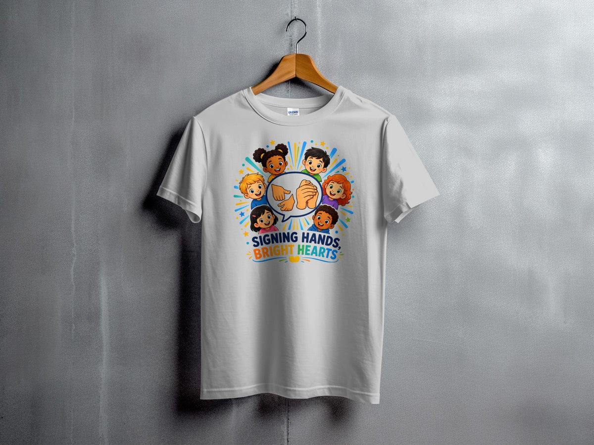 White t-shirt with cartoon children and text "Signing Hands, Bright Hearts".