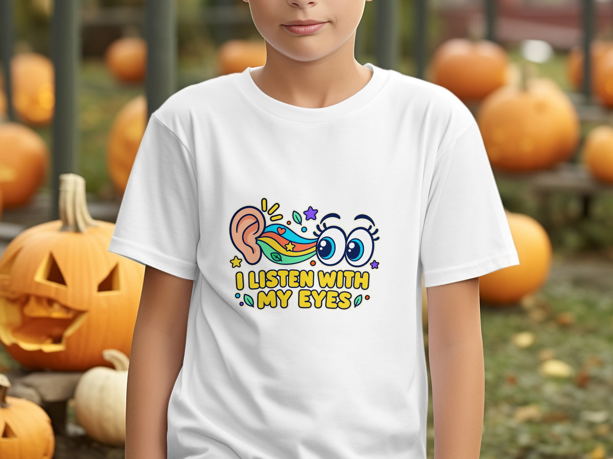 White t-shirt with cartoon ear, rainbow, and eyes design.
