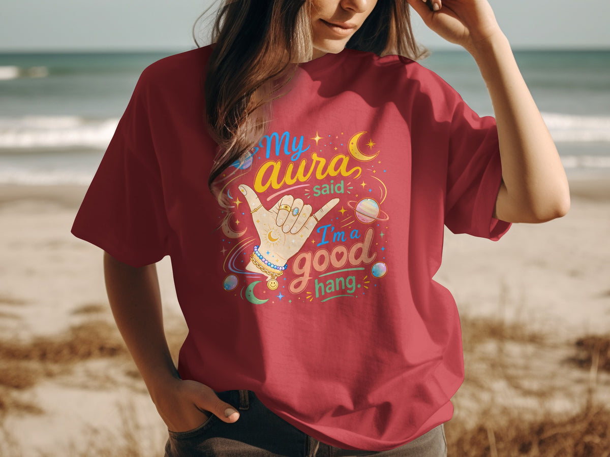 Red t-shirt with "My aura said I'm a good hang" graphic and celestial elements.