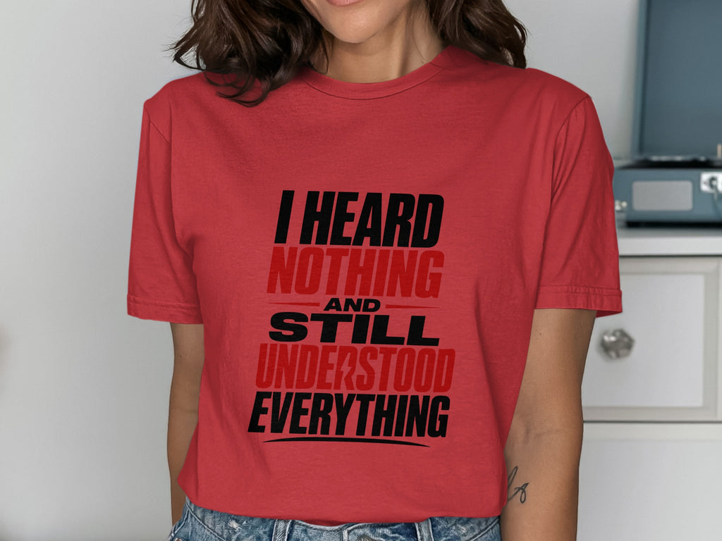 Red t-shirt with black and red text that reads "I HEARD NOTHING AND STILL UNDERSTOOD EVERYTHING".