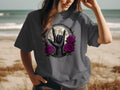 Dark t-shirt with rock and roll hand, moon, thorns, and roses design.
