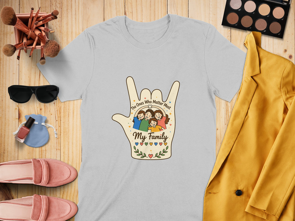 Light grey t-shirt with hand graphic of smiling family, text "The Ones Who Matter Most My Family".