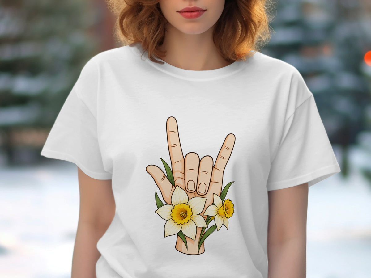 White t-shirt with a hand making the rock-on sign surrounded by daffodils.