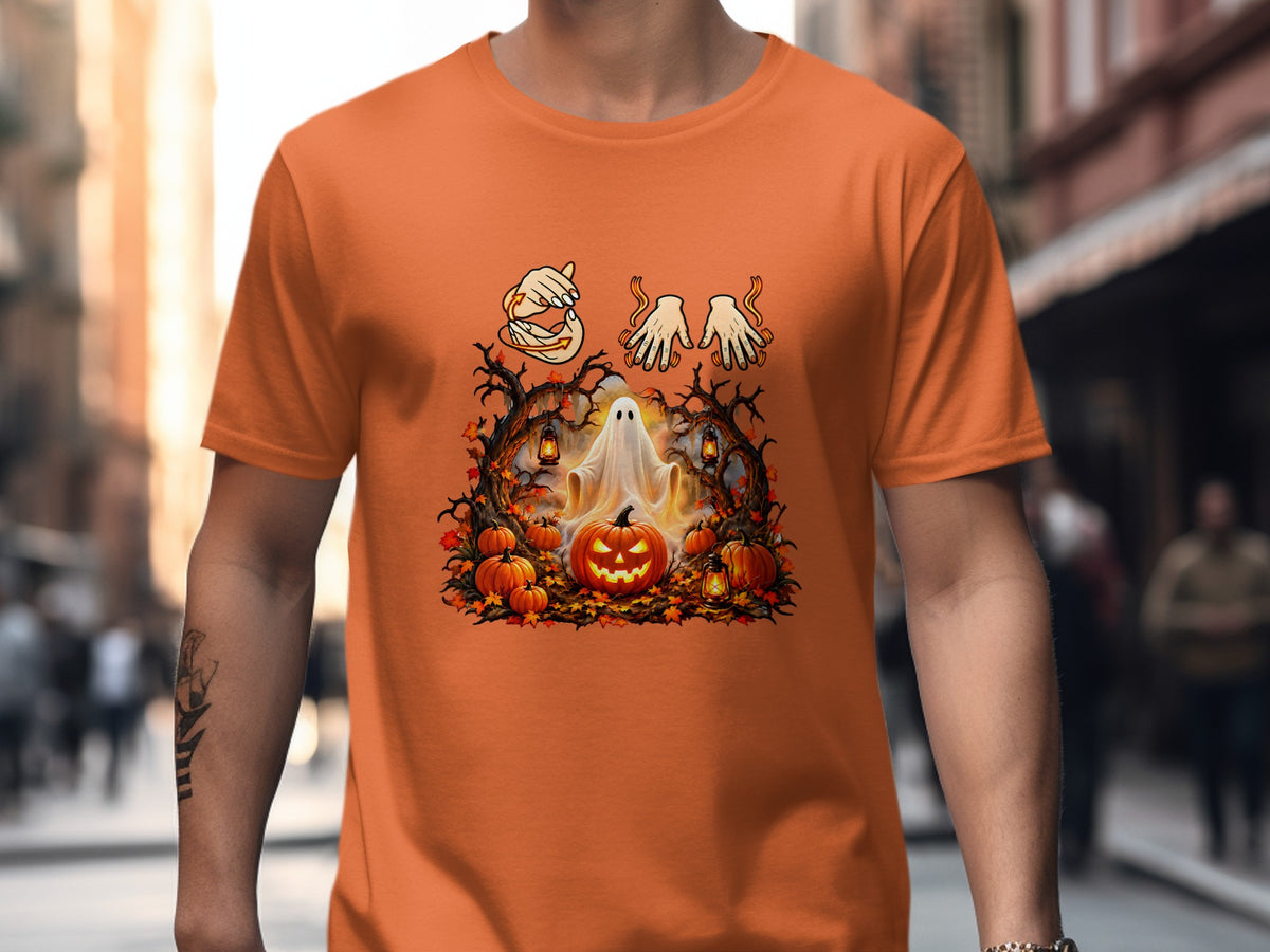 Orange t-shirt with a Halloween graphic featuring a ghost, pumpkins, and skeletal hands.