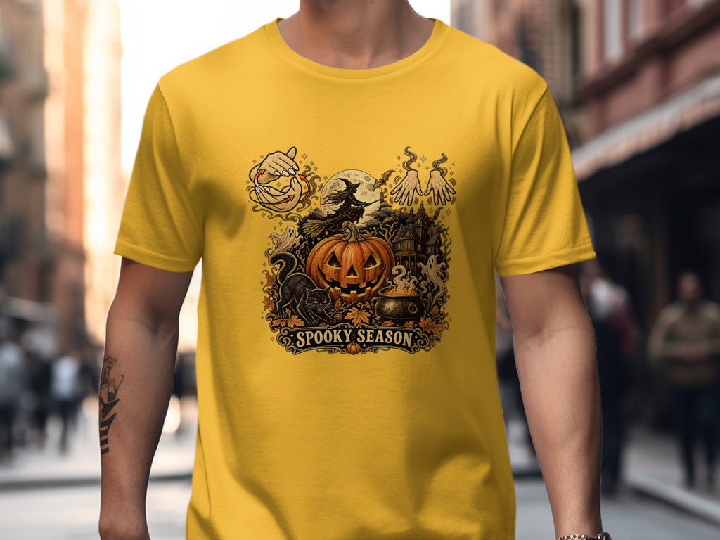Yellow t-shirt with a Spooky Season Halloween graphic featuring a pumpkin, witch, and haunted house.