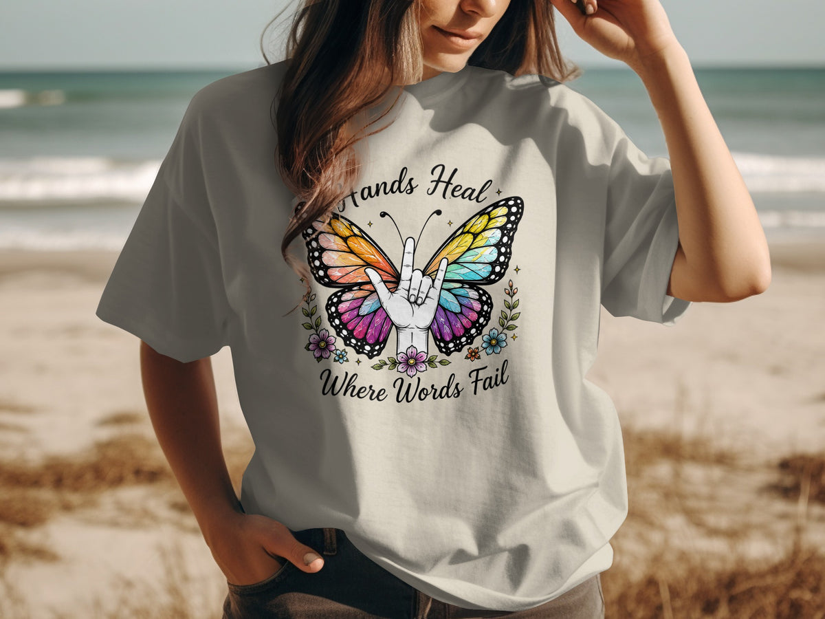 Butterfly with "Hands Heal Where Words Fail" text and ASL sign for I Love You.