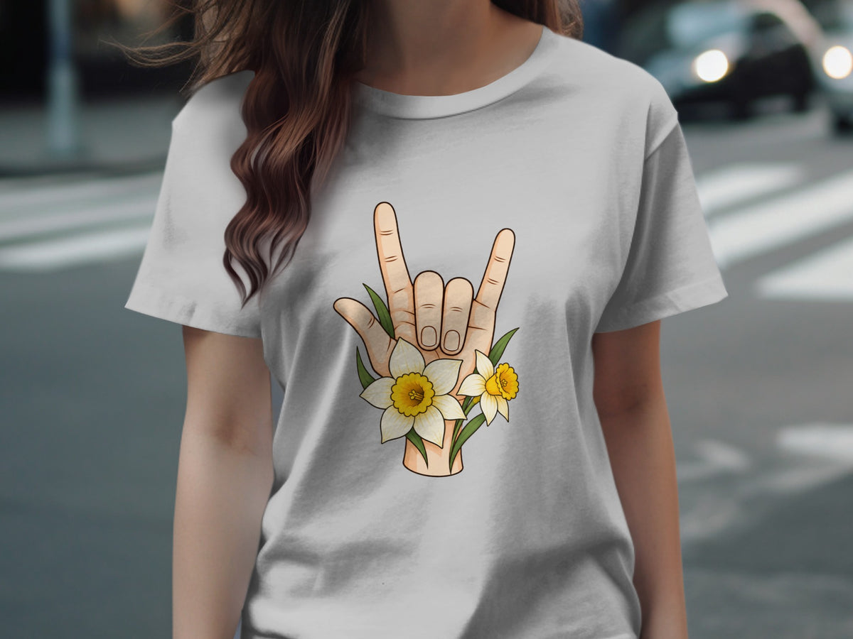 T-shirt with a hand gesture and daffodils graphic on the front.
