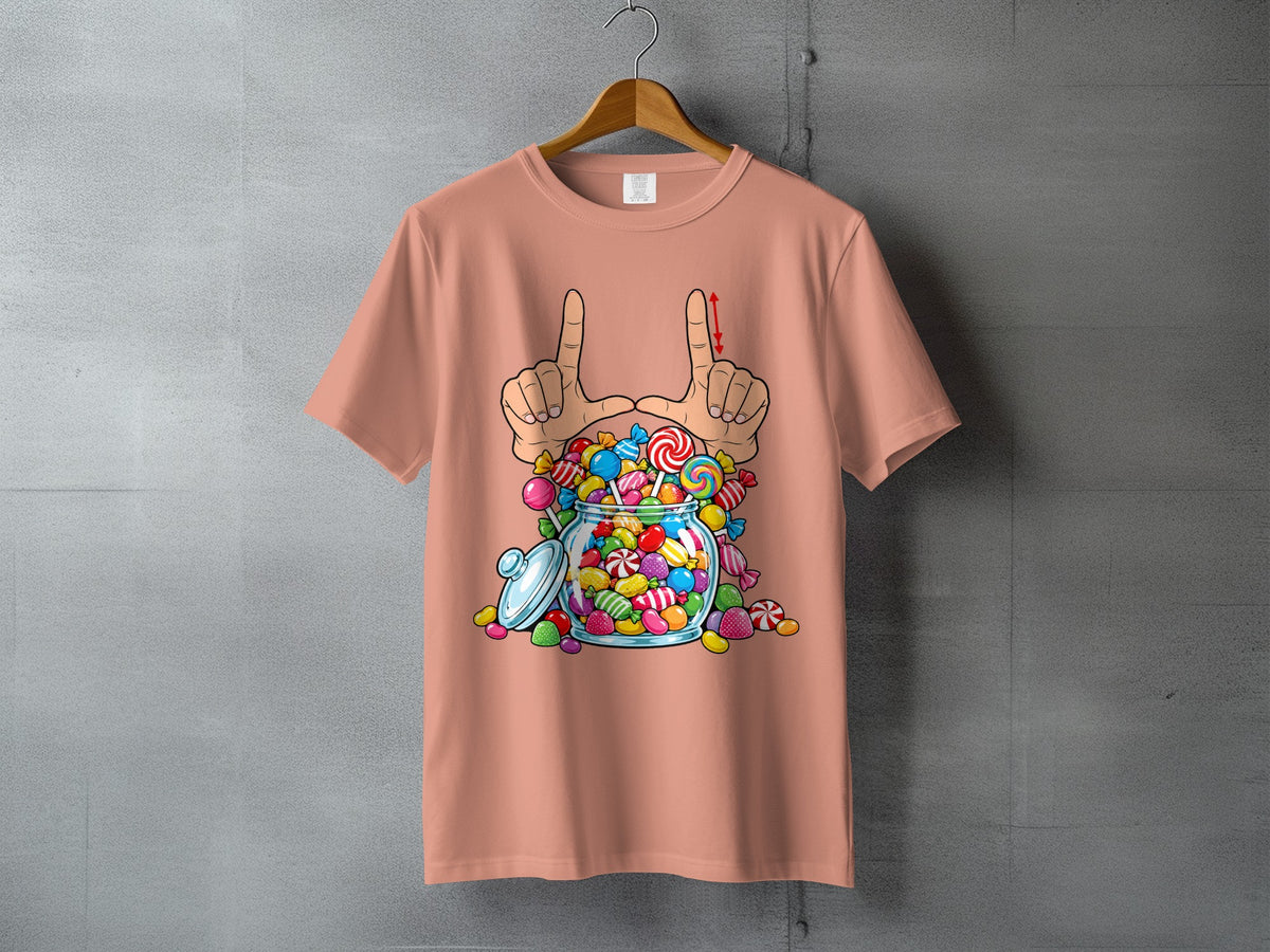Peach t-shirt with a graphic of hands framing a jar full of colorful candies.
