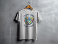 White t-shirt with colorful heart handshake graphic and text "TALKING HANDS TELLING STORIES".