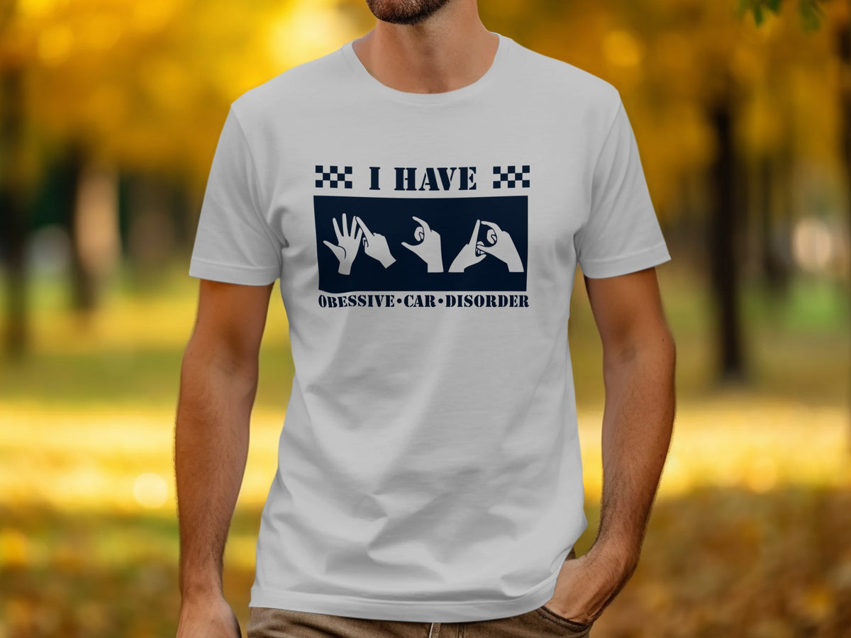 White t-shirt with "I HAVE OBSESSIVE CAR DISORDER" and car-related hand gestures.
