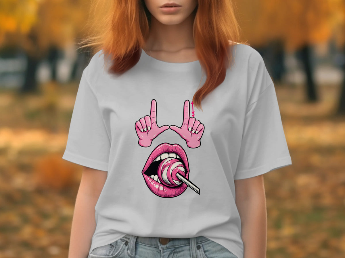 White t-shirt with graphic of pink lips, lollipop, and hands forming a frame.