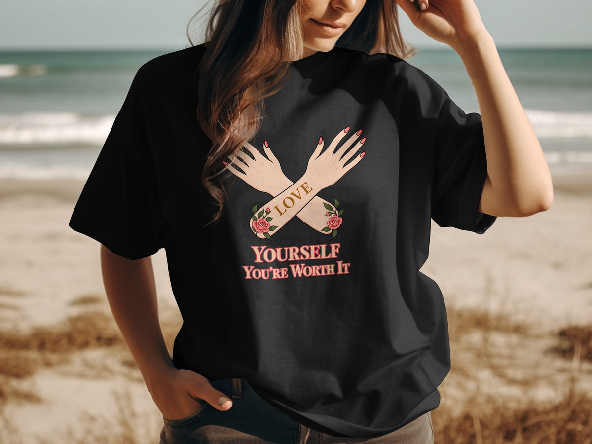Black t-shirt with crossed arms graphic, "LOVE YOURSELF YOU'RE WORTH IT" text.