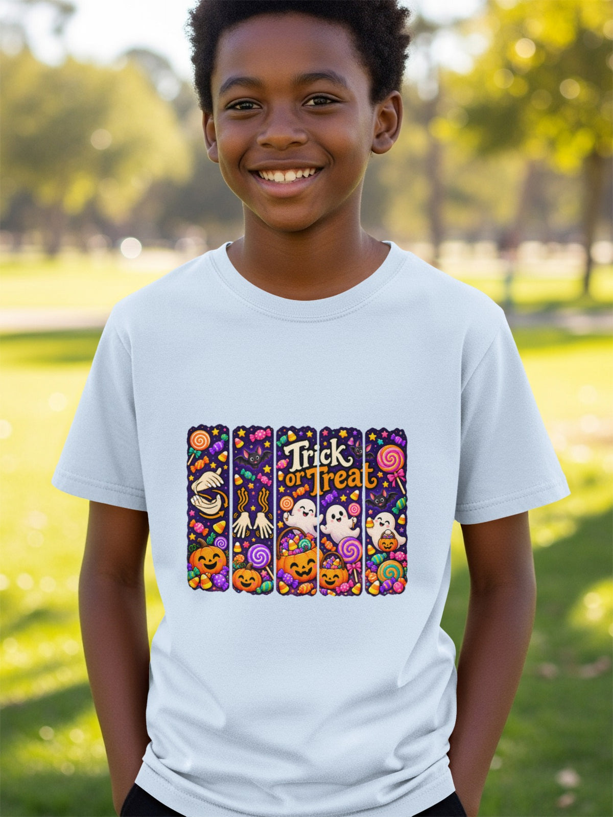 T-shirt with a colorful Halloween graphic featuring pumpkins, ghosts, candy, and the text "Trick or Treat."