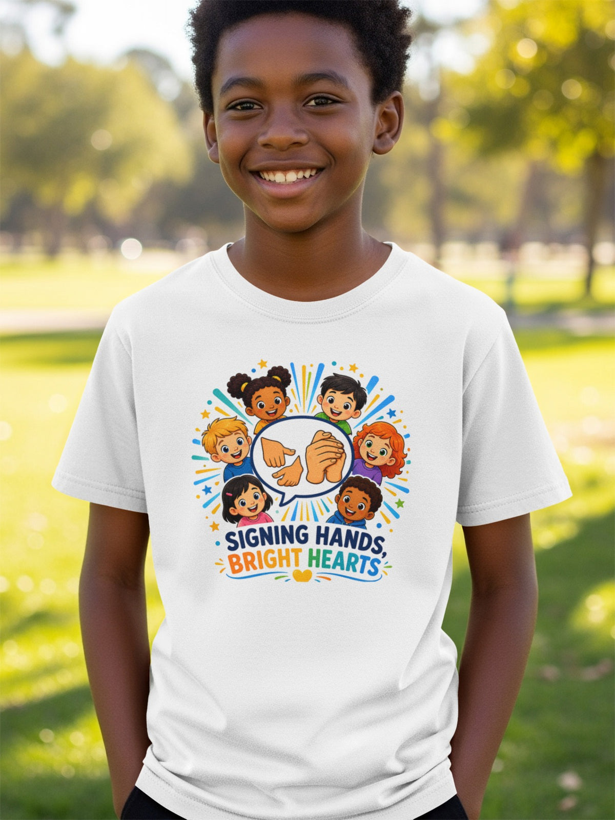 Children's t-shirt with "Signing Hands, Bright Hearts" graphic and diverse cartoon children.