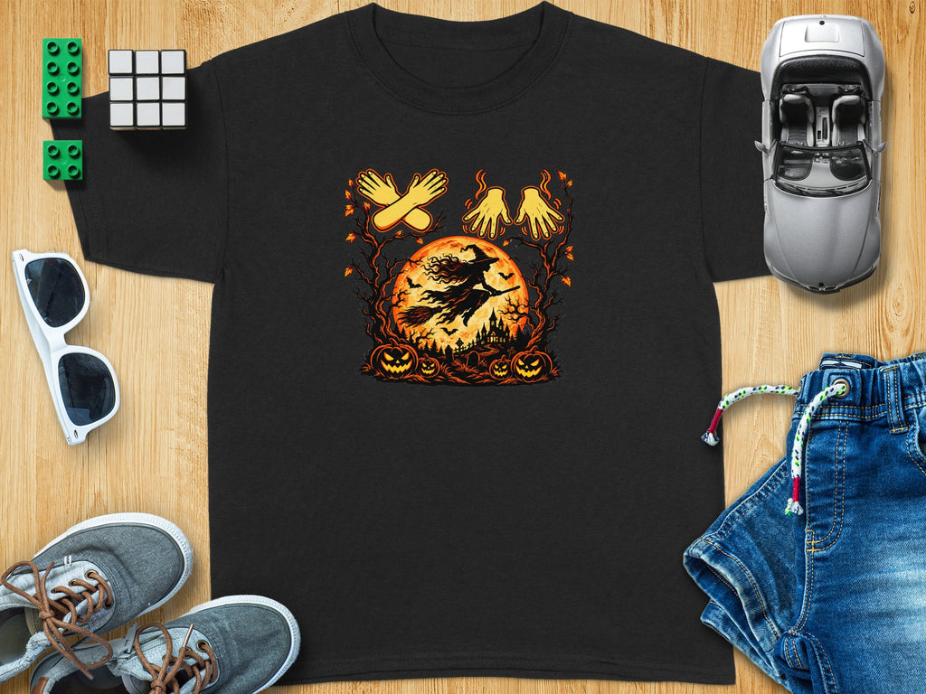 Black t-shirt with a Halloween graphic of a witch flying on a broomstick over a pumpkin patch.