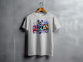 White t-shirt with a colorful "AUSLAN" graphic featuring a koala and Australian flag elements.