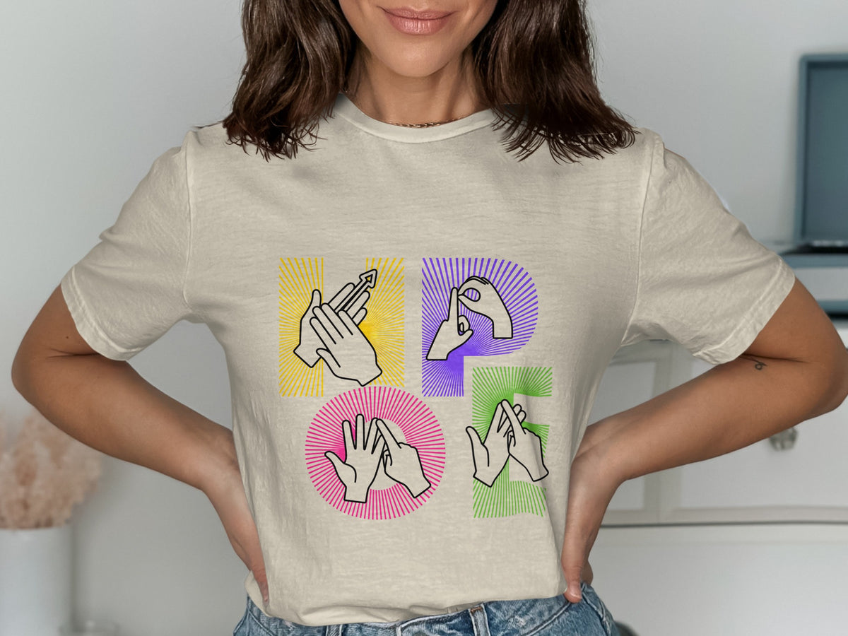 T-shirt with "HOPE" in sign language hands on a light beige shirt.